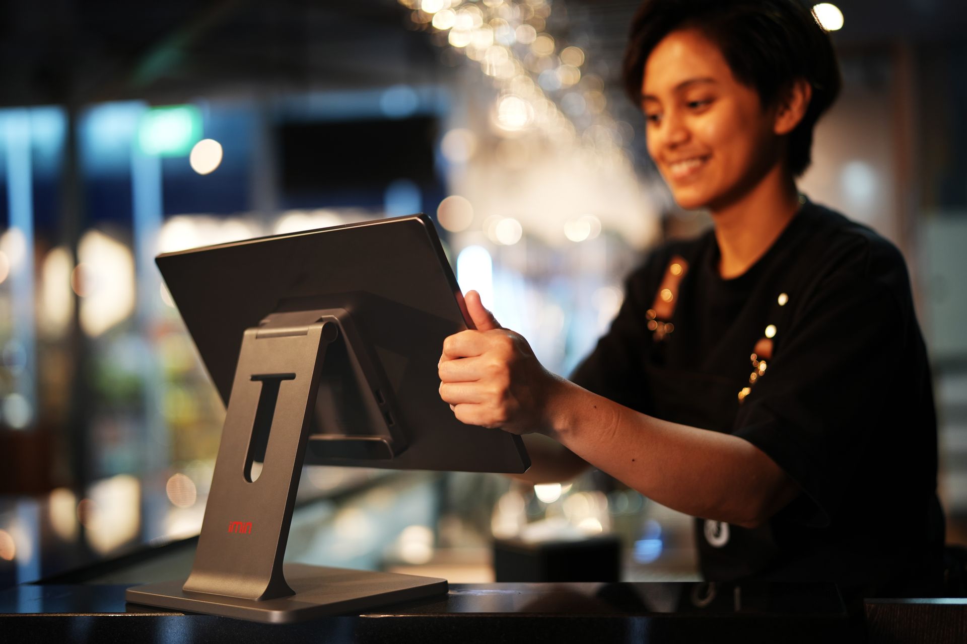 A retail employee working at a store point-of-sale